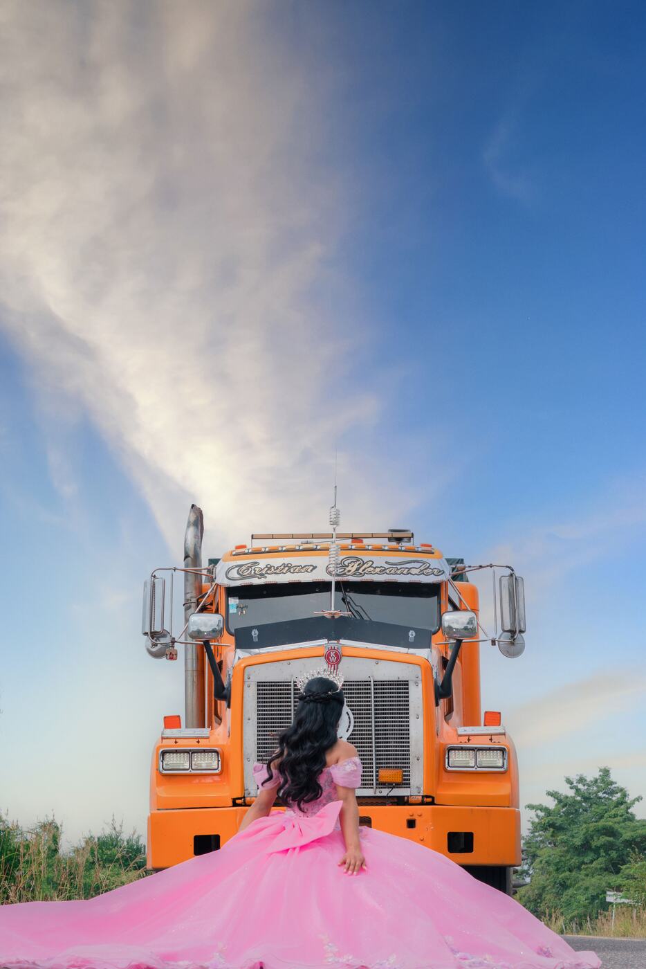An orange semi truck representing trucking culture, matching the Truckers Dating sleeper-cab-friendly design
